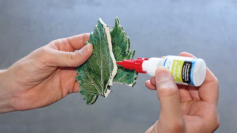 Allbond-Set: 10 g Allbond Fluid + 30 ml Spray, im Blisterkarton Finger, Person, Blatt, Kräuterig, Baby